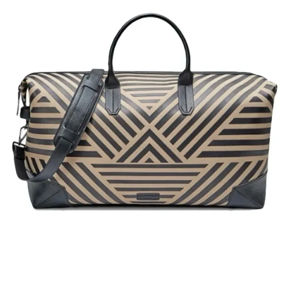 Uri Minkoff tan and black leather geometric design travel bag